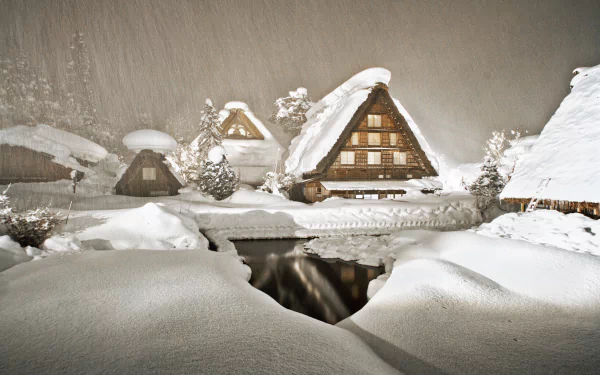 Snow-covered traditional houses in Shirakawa village, Gifu Prefecture, Japan, during a winter snowfall, captured in stunning 4K Ultra HD quality.