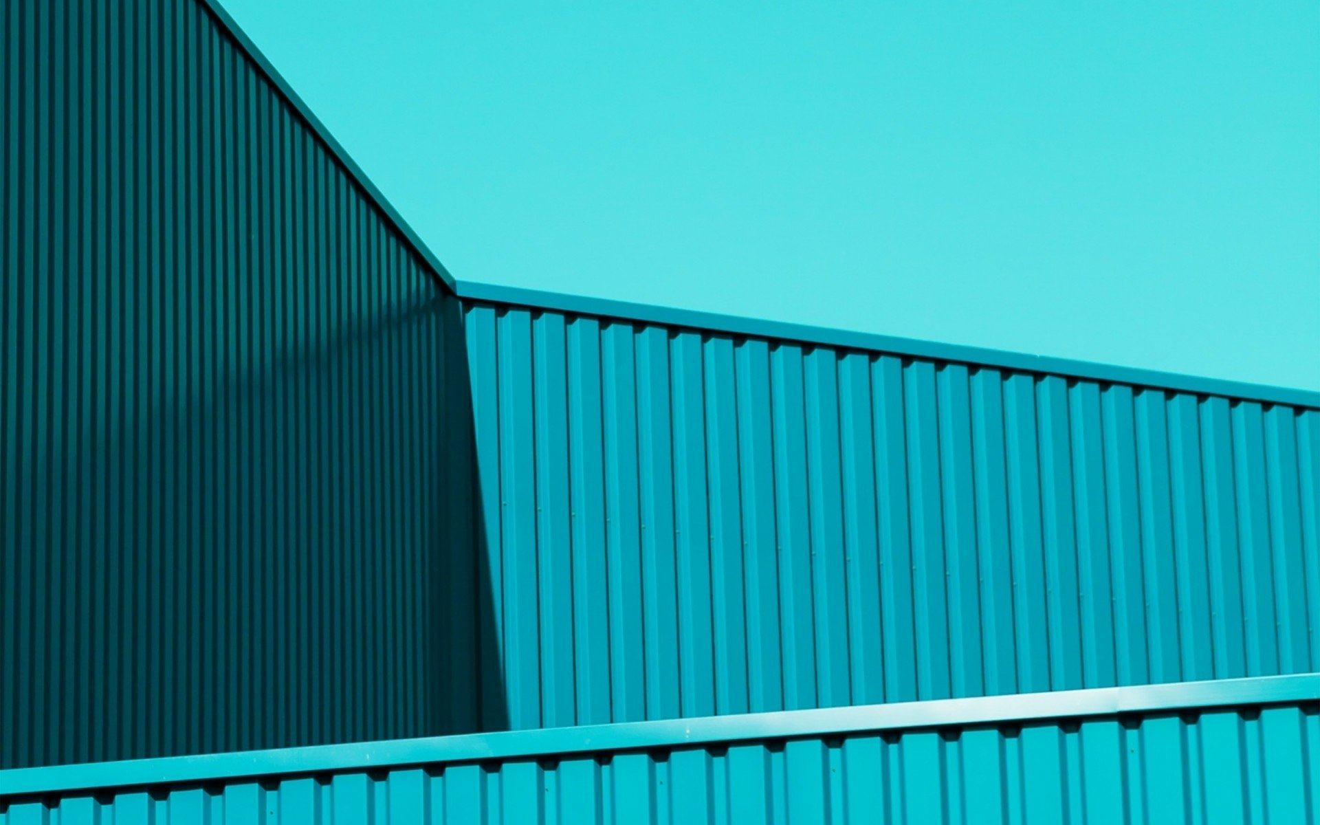 Abstract turquoise HD PC desktop wallpaper: corrugated metal panels and intersecting rooflines form a clean, geometric diagonal composition.