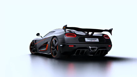 HD desktop wallpaper featuring a sleek black Koenigsegg Agera RS hypercar, showcasing its aerodynamic design and signature rear details against a white background.