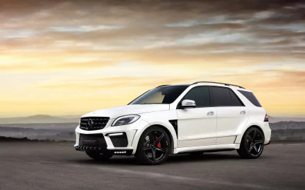 White Mercedes-Benz ML63 AMG 4x4 SUV parked on an open road with a dramatic sunset sky, showcased as a high-definition desktop wallpaper background.