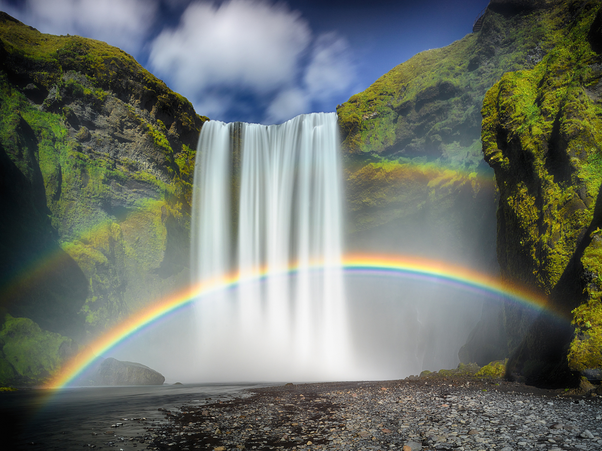 Rainbows of Skógafoss by Guy Havell