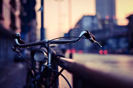 A close-up of a bicycle handlebars glistening with rain in a city setting, showcasing a serene atmosphere as soft lights from vehicles illuminate the wet street. 4K Ultra HD quality.