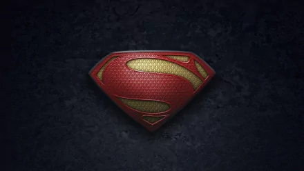 A striking HD wallpaper featuring the iconic Superman logo from the movie Man of Steel, set against a dark textured background.