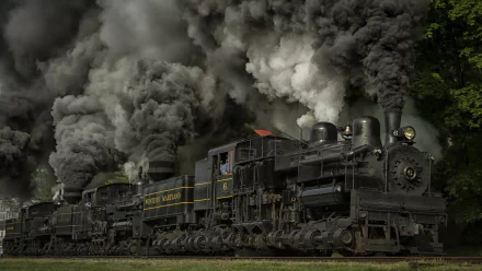 A dramatic steam train billows thick smoke as it moves, showcasing vintage power and engineering. This HD image serves as an engaging PC desktop wallpaper and background.