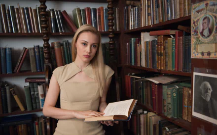 Canadian actress Sarah Gadon with blue eyes and blonde hair reads a book in a vintage library setting, inspired by the movie Cosmopolis.