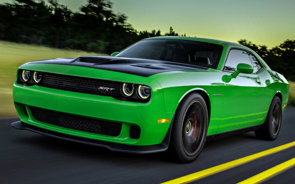 HD desktop wallpaper featuring a vibrant green Dodge Challenger SRT Hellcat, with a sleek body design, driving on a road with a blurred background of trees and sky.