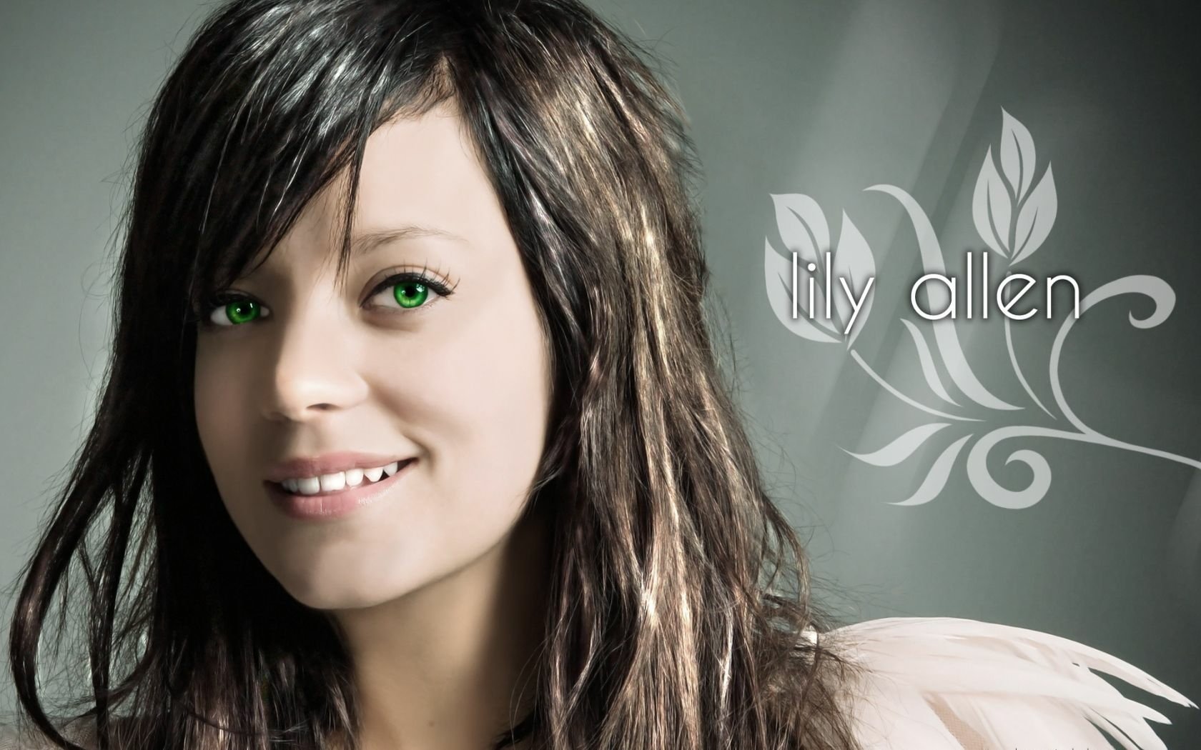HD music desktop wallpaper: smiling woman with green eyes and long hair, floral swirls and stylized text lily allen.