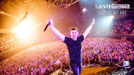 A captivating HD wallpaper featuring DJ Hardwell performing energetically on stage, with a massive crowd celebrating under vibrant lights.