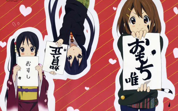 5K Ultra HD PC desktop wallpaper of Azusa Nakano, Yui Hirasawa, and Mio Akiyama from K-ON! holding handwritten signs against a red, heart-patterned background.