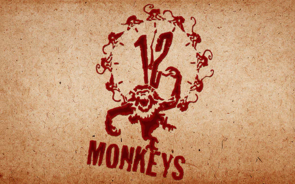 HD PC desktop wallpaper featuring the movie 12 Monkeys logo with a stylized red monkey and twelve smaller monkeys arranged in a circle on a textured beige background.