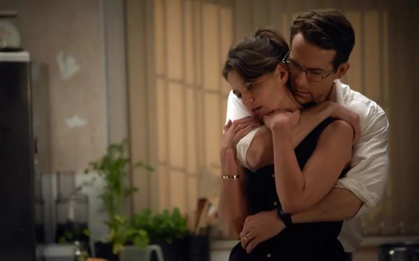 HD PC desktop wallpaper featuring Katie Holmes and Ryan Reynolds in an intimate scene from the movie Woman in Gold.