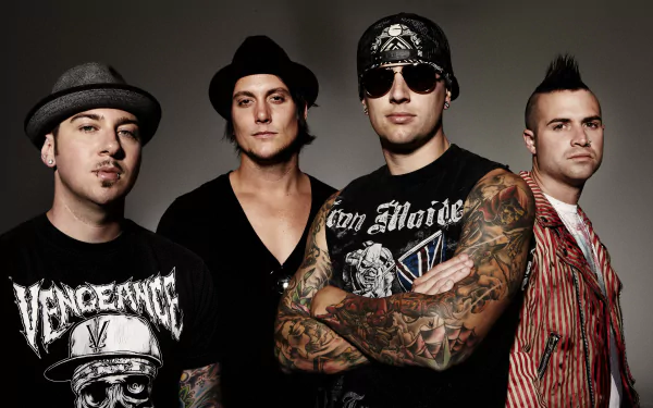 HD desktop wallpaper and background featuring the band Avenged Sevenfold. Four band members are standing, dressed in edgy outfits with tattoos visible. The image exudes a rock music vibe.