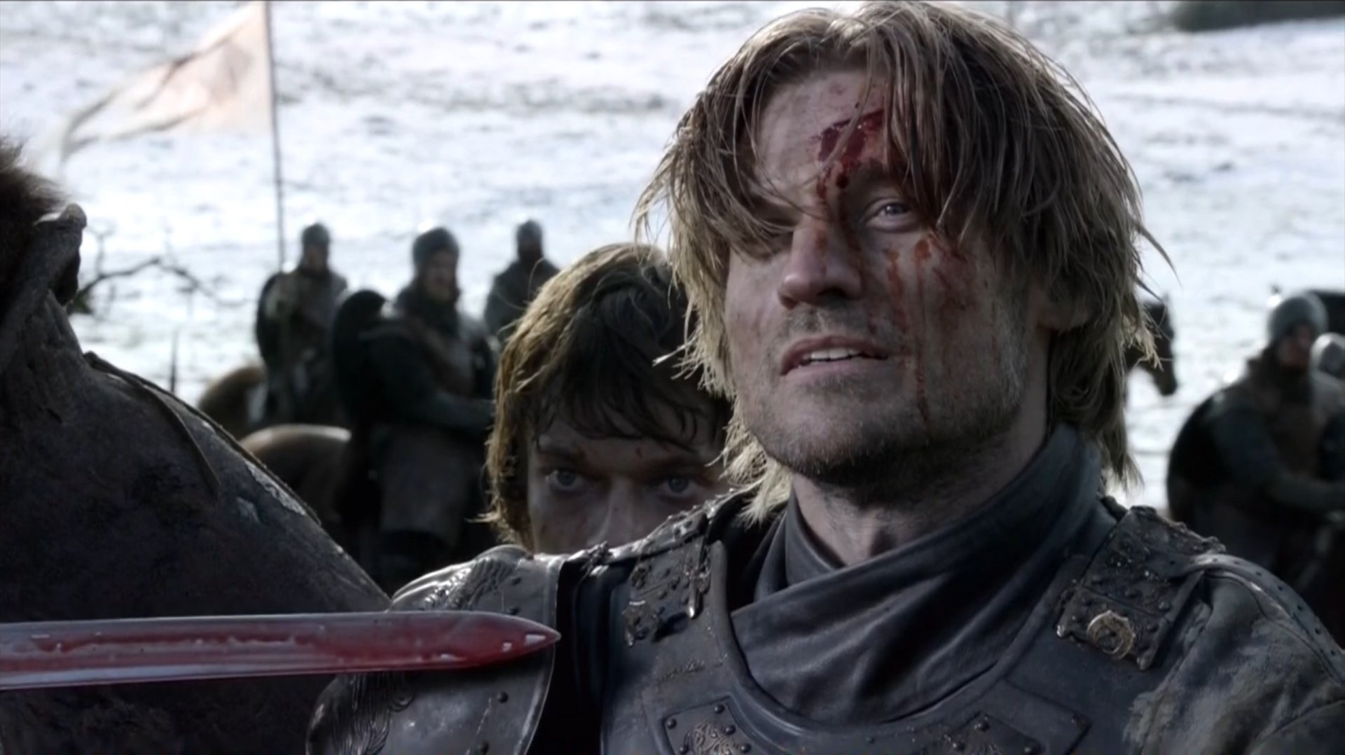 Game of Thrones HD wallpaper: bloodied Jaime Lannister in armor, grimacing on a snowy battlefield while Theon Greyjoy peers from behind.