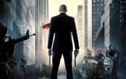 A striking HD wallpaper from Hitman: Agent 47, featuring the iconic character in a suit, facing an urban battleground surrounded by armed foes and a tense atmosphere.