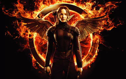 HD desktop wallpaper featuring Jennifer Lawrence as Katniss Everdeen with a fiery background, inspired by The Hunger Games: Mockingjay - Part 1 movie.