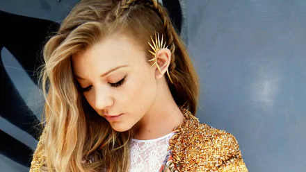 A striking HD desktop wallpaper featuring Natalie Dormer, showcasing her elegant hairstyle and unique accessory, set against a vibrant backdrop.