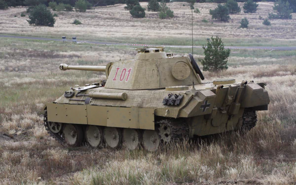 4K Ultra HD PC desktop wallpaper featuring a military tank positioned on a grassy field with sparse trees in the background.