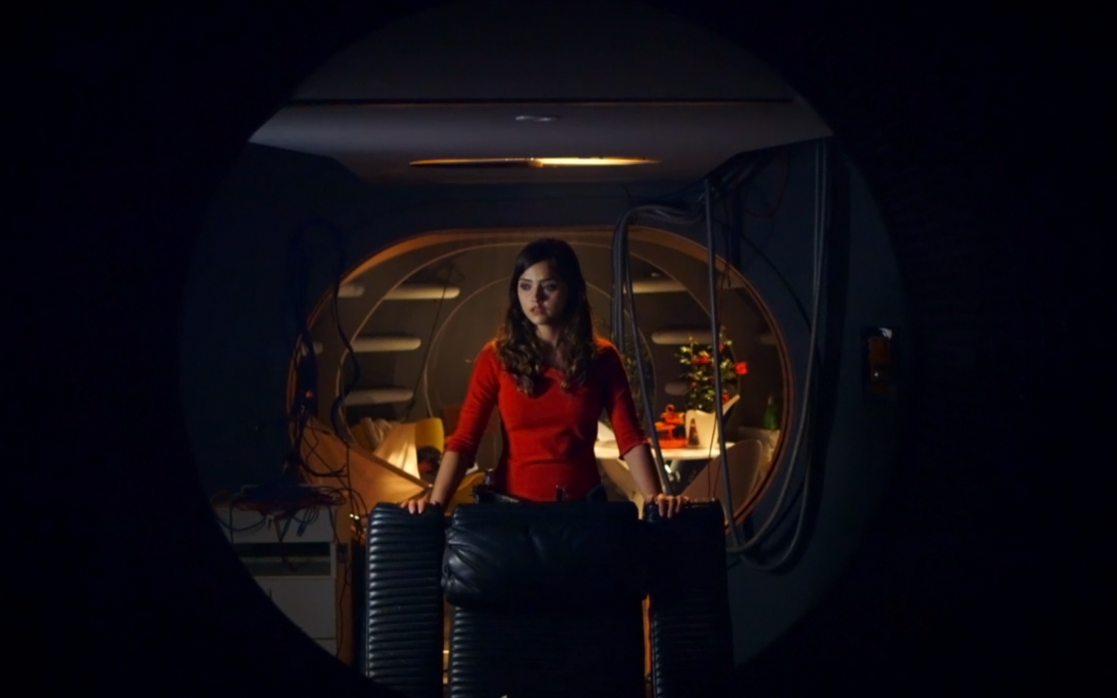 Clara Oswald, portrayed by Jenna Coleman in Doctor Who (2005), stands inside a spaceship interior, featured in an HD PC desktop wallpaper background.