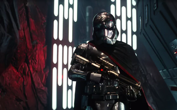Captain Phasma stands confidently in a dimly lit corridor, gripping her weapon, from *Star Wars Episode VII: The Force Awakens*. A striking HD wallpaper showcasing this iconic character.