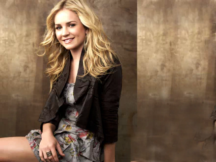 HD desktop wallpaper of American actress Brittany Robertson with blonde hair, smiling against a neutral brown background.