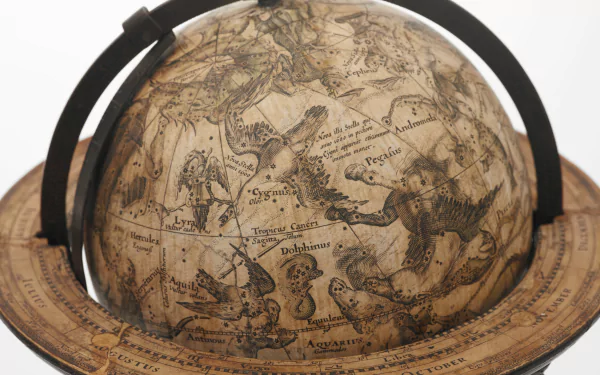 Artistic HD desktop wallpaper featuring a vintage-style globe with detailed, sepia-toned map illustrations and classical celestial designs.