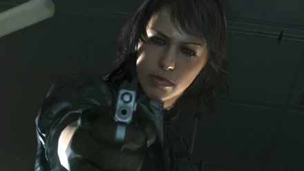 A close-up of a character from Metal Gear Solid V: The Phantom Pain, aiming a gun with a focused expression, set against a dark, high-definition background.