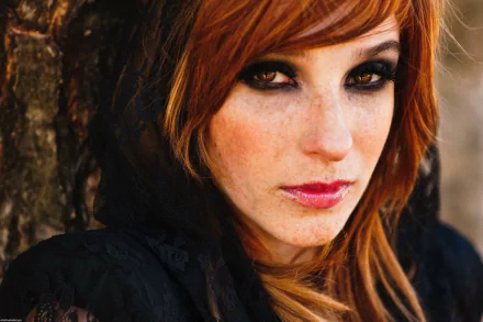 HD PC desktop wallpaper featuring a close-up portrait of a woman with red hair and intense eyes, identified as Vica Kerekes.