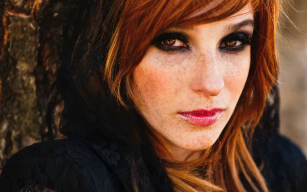 HD PC desktop wallpaper featuring a close-up portrait of a woman with red hair and intense eyes, identified as Vica Kerekes.