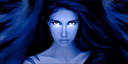 HD wallpaper of a fantasy angel with piercing eyes, enveloped in blue hues. The mystical and intense expression adds a captivating touch to any desktop background.