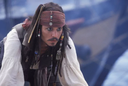 Jack Sparrow, portrayed by Johnny Depp, captures the essence of adventure in this HD wallpaper from Pirates Of The Caribbean: The Curse Of The Black Pearl.