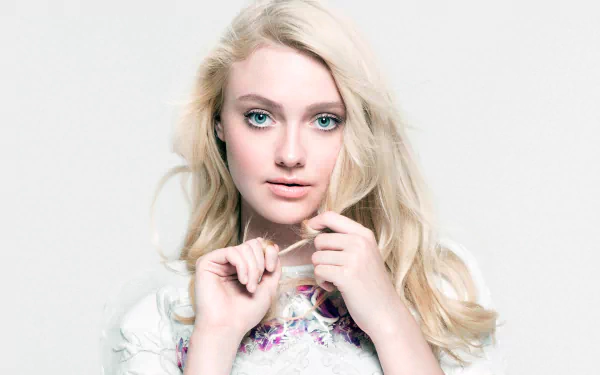 HD PC desktop wallpaper featuring celebrity Dakota Fanning with light blonde hair and striking blue eyes against a soft white background.