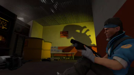 A high-definition desktop wallpaper featuring Scout from Team Fortress 2, with a dramatic xenomorph shadow cast on the wall, showcasing a blend of action and tension in a video game setting.
