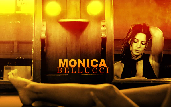 HD PC desktop wallpaper featuring celebrity Monica Bellucci with a warm, golden-hued background and elegant, relaxed pose.
