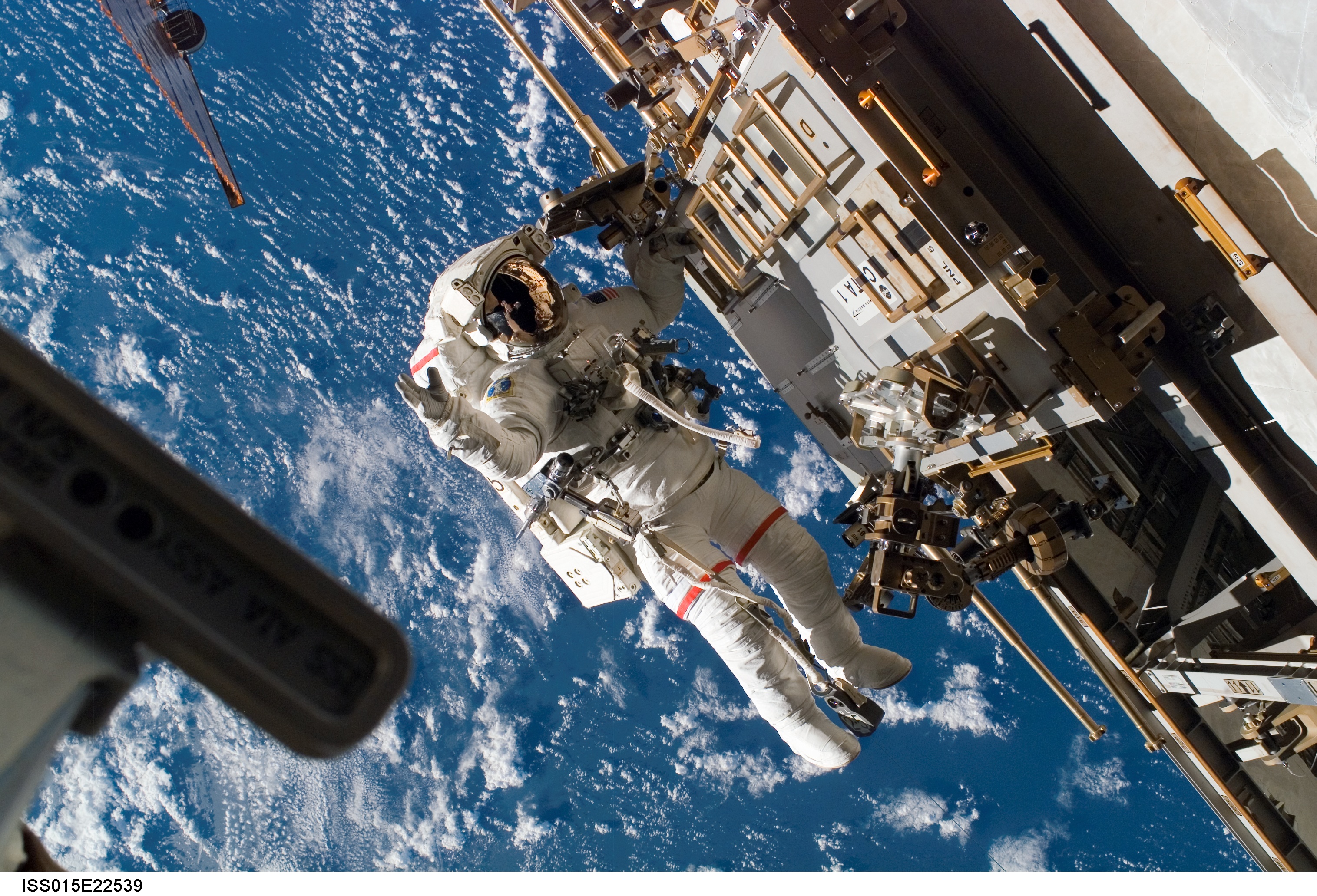 Astronaut floating outside International Space Station in space