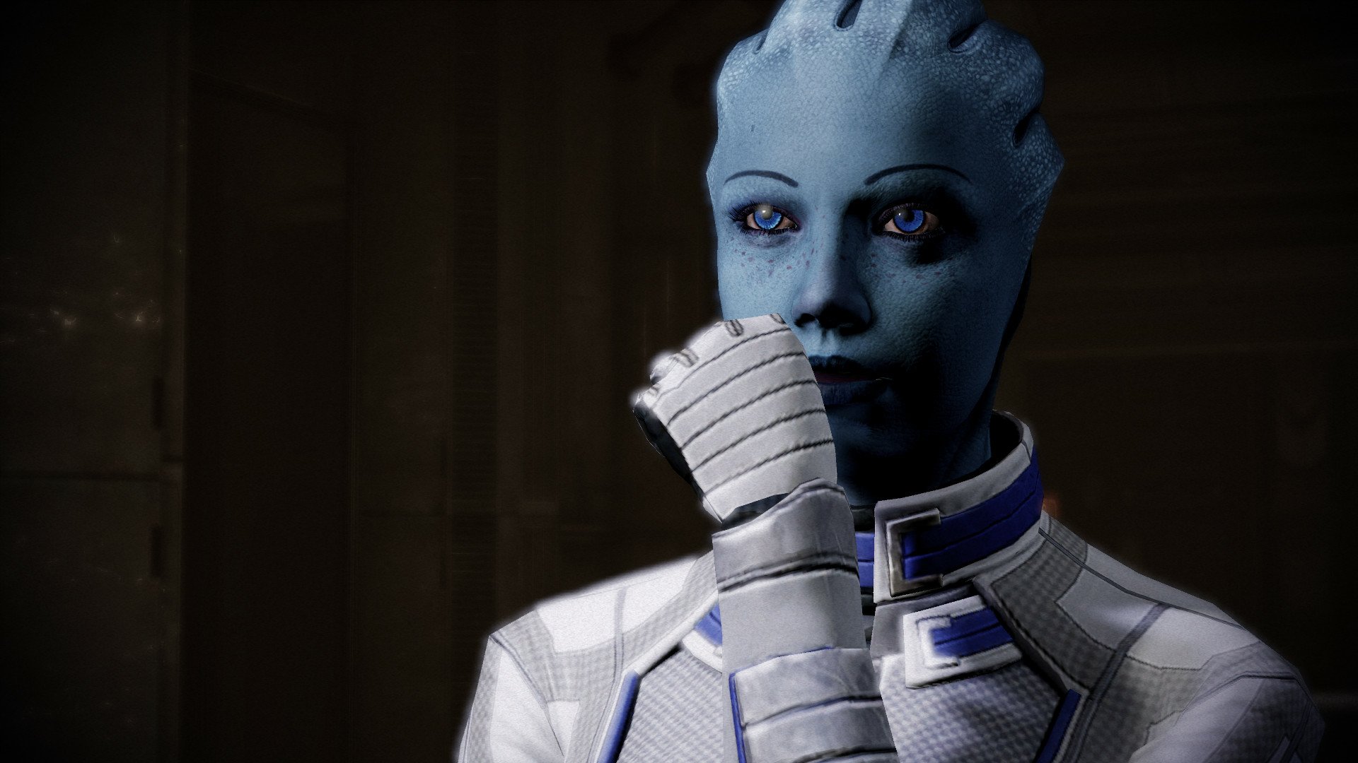 HD desktop wallpaper of Liara T'Soni from Mass Effect, poised thoughtfully with a hand to her chin.