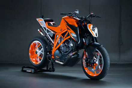 HD desktop wallpaper featuring a bright orange KTM 1290 Super Duke motorcycle against a dark background.