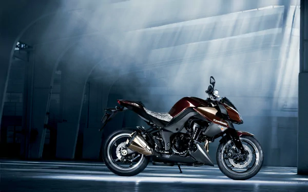 HD PC desktop wallpaper: Kawasaki Z1000 motorcycle in a dim industrial hangar, dramatic beams of light highlighting its sleek black-and-red body.