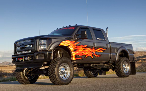 A striking Ford F-250 Super Duty truck with flame graphics, showcased in a dynamic setting. This 4K Ultra HD image serves as an impressive desktop wallpaper.