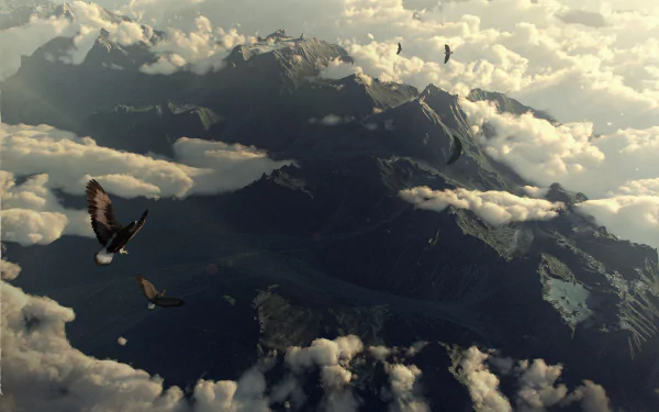 HD PC desktop wallpaper from the movie The Hobbit: The Battle of the Five Armies, showing a mountainous landscape partially covered by clouds with birds soaring above.