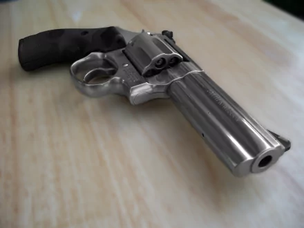 HD desktop wallpaper featuring a detailed close-up of a man-made revolver resting on a wooden surface.