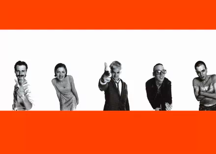 HD PC desktop wallpaper: five black-and-white characters from the movie Trainspotting lined across a white stripe between bold orange horizontal bands.
