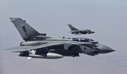 HD desktop wallpaper featuring two Panavia Tornado military jets flying in formation against a clear sky.