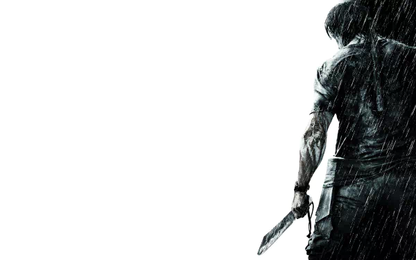 HD desktop wallpaper of the movie Rambo featuring the back of a muscular figure holding a large knife, with rain dramatically falling. The white background emphasizes the intense and gritty atmosphere.