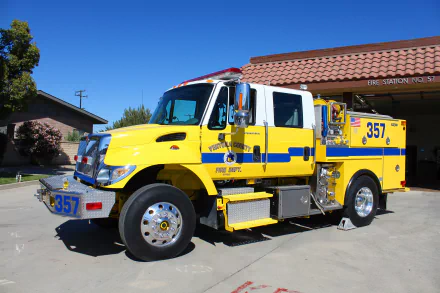 Yellow International fire truck (Engine 357) parked outside a station under a clear blue sky — 4K Ultra HD PC desktop wallpaper/background, vehicle