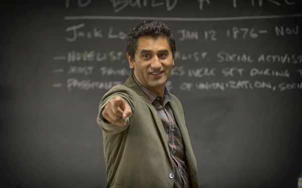 A scene from the TV show Fear the Walking Dead, featuring a confident character pointing, set against a classroom blackboard backdrop. 4K Ultra HD wallpaper and background.