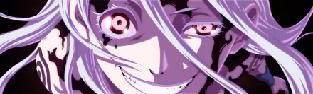 Close-up of Shiro from the anime Deadman Wonderland, featuring her bright red eyes and signature mischievous smile, set against a vividly colorful background. HD desktop wallpaper.