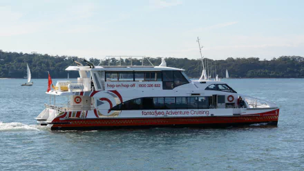 A catamaran ferry cruising on Sydney Harbour, Australia, captured in HD as a desktop wallpaper and background.