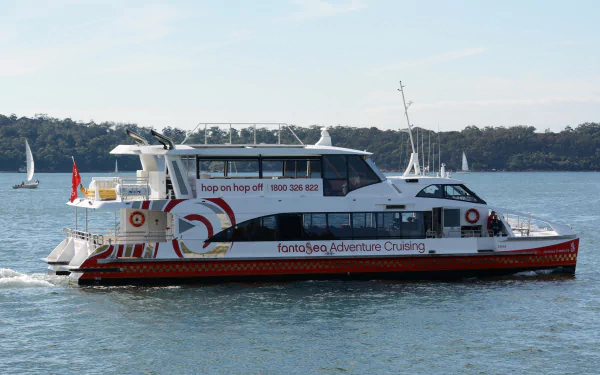 A catamaran ferry cruising on Sydney Harbour, Australia, captured in HD as a desktop wallpaper and background.