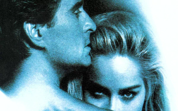 Blue-tinted HD desktop wallpaper of two unidentified actors in an intimate, close embrace, evoking a 1990s erotic thriller movie mood.