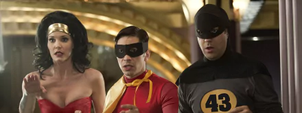 HD desktop wallpaper featuring Leslie Bibb, Jason Sudeikis, and Justin Long in superhero costumes from the movie Movie 43.